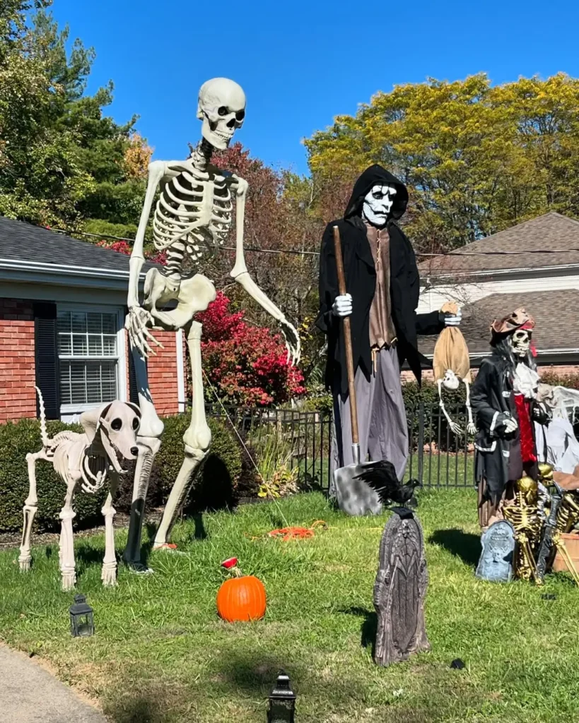 How To Decorate The Front Of Your House For Halloween - walkway with skeletons holding lanterns or candy buckets