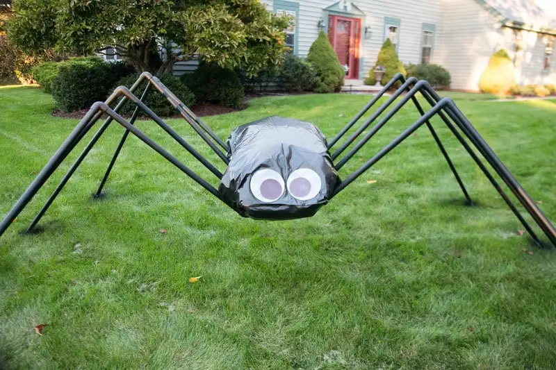 How To Decorate The Front Of Your House For Halloween -  Giant Spider in Bushes